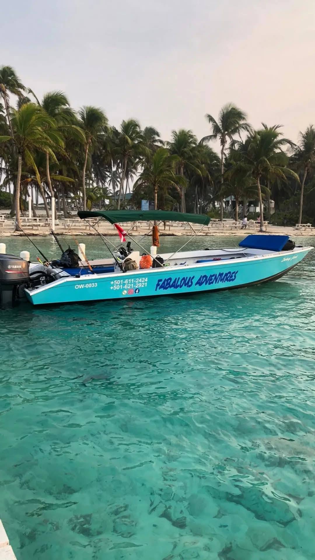 The Fabulous Adventures boat, with blue brush lettering on its hull